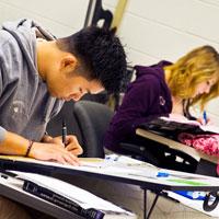 Students practicing engineering sketching in class